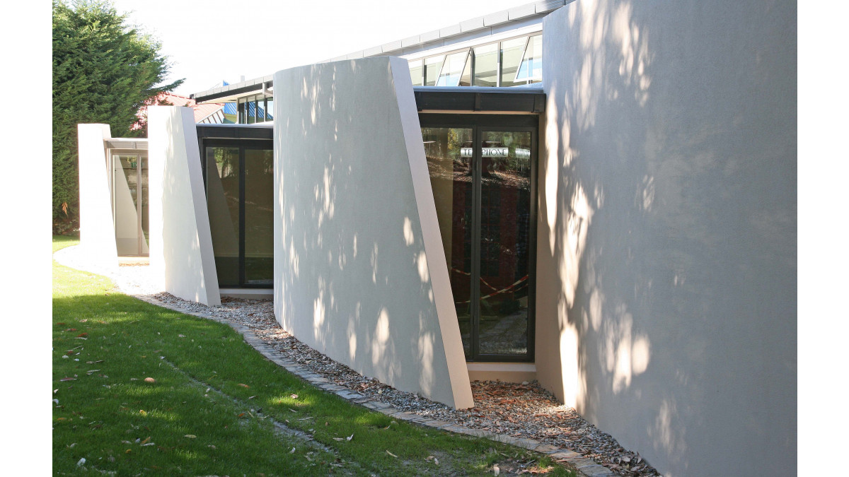 Curved forms on the road frontage allow natural light in from the west.