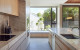 natural light streams into the kitchen