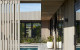 sliding doors and wooden screens can open up or shut off spaces