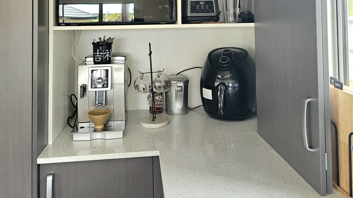 Cinetto Bifolds for Over Bench Kitchen Appliance Storage. Project by Mangawhai Kitchens