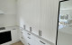 Cinetto Bifolds for Over Bench Kitchen Storage. Project by Huis Joinery CLOSED