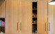 Cinetto Bifolds for Over Bench Pantry and Appliance Storage Project by Seaform Kitchens and Interiors.