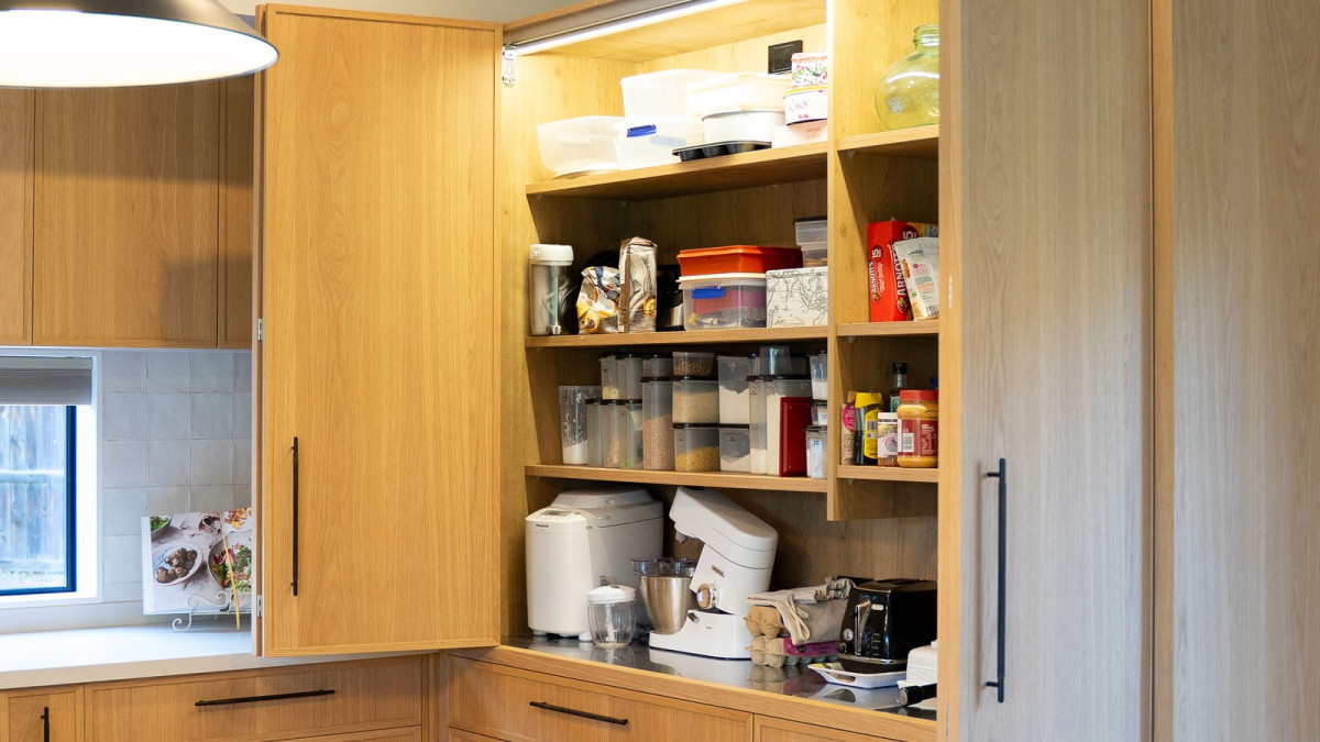 Cinetto Bifolds for Over Bench Pantry and Appliance Storage. Project by Seaform Kitchens and Interiors.