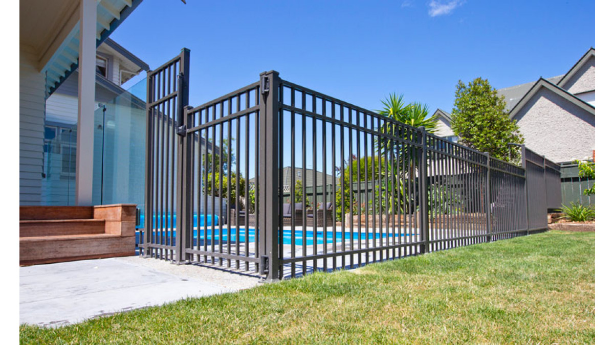 Contemporary fencing and matching gate for pool on award winning home