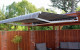 Deauville Awning offers additional afternoon shade for this outdoor area