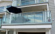 Front deck with stunning Auckland harbour view through Edgetec Infinity frameless glass balustrades