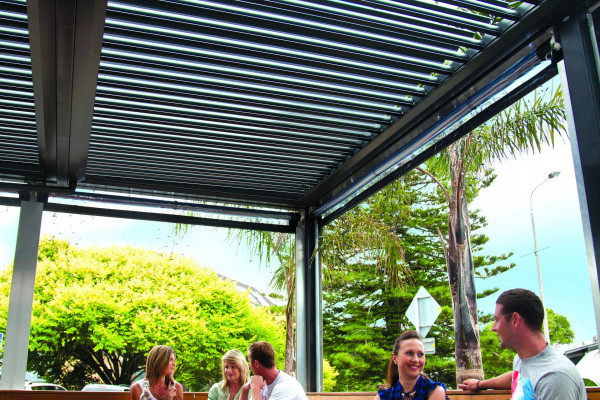 Add Architectural Flair and Function to a Cafe with a Louvretec Opening Roof