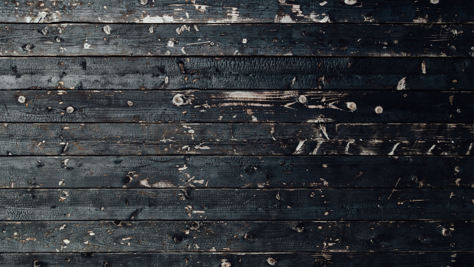 Black wood background, charred planks, painted black stain boards