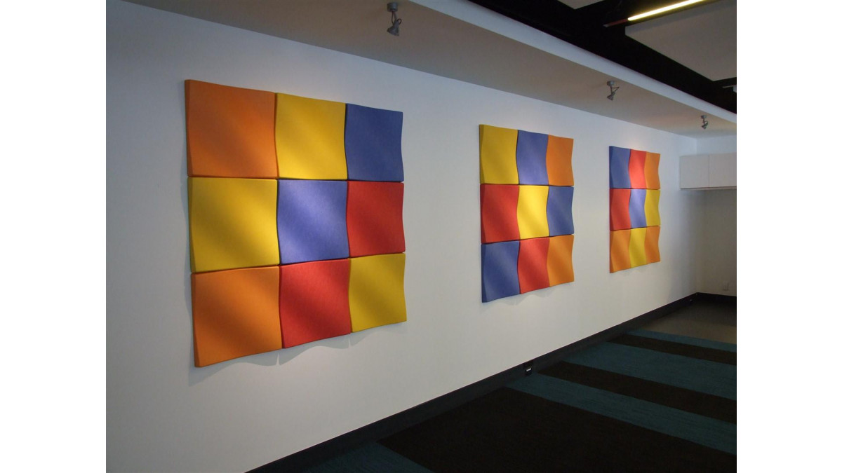 EchoPanel Mura 3D Fabric Tiles in bright colours.