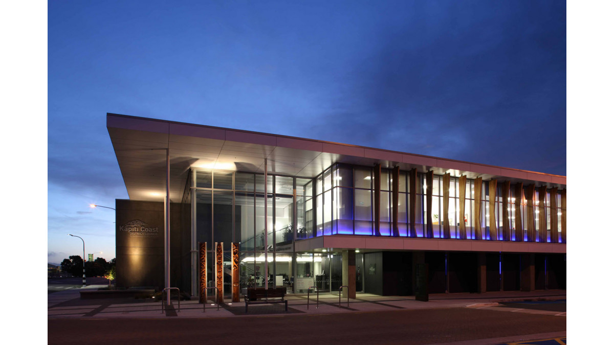 LED lights behind the building’s spandrel panels glow blue at night.