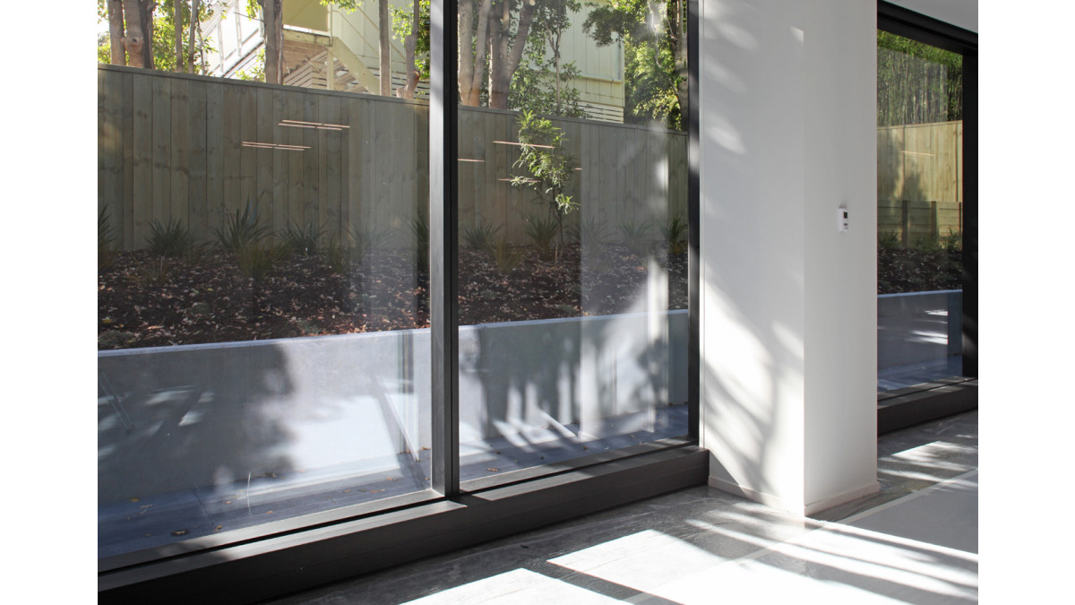 An aluminium box section in Black Frost anodised at the sill provided a cosmetic cover for electrical trunking and window brackets.