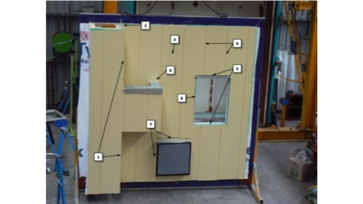 Vertical Stria cladding being tested for weather tightness. The arrows indicate to the details built as per technical specification. 