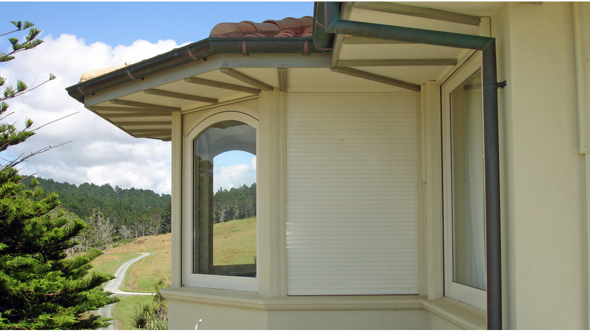 Open or shut, the roller shutters blend into this home's finish.