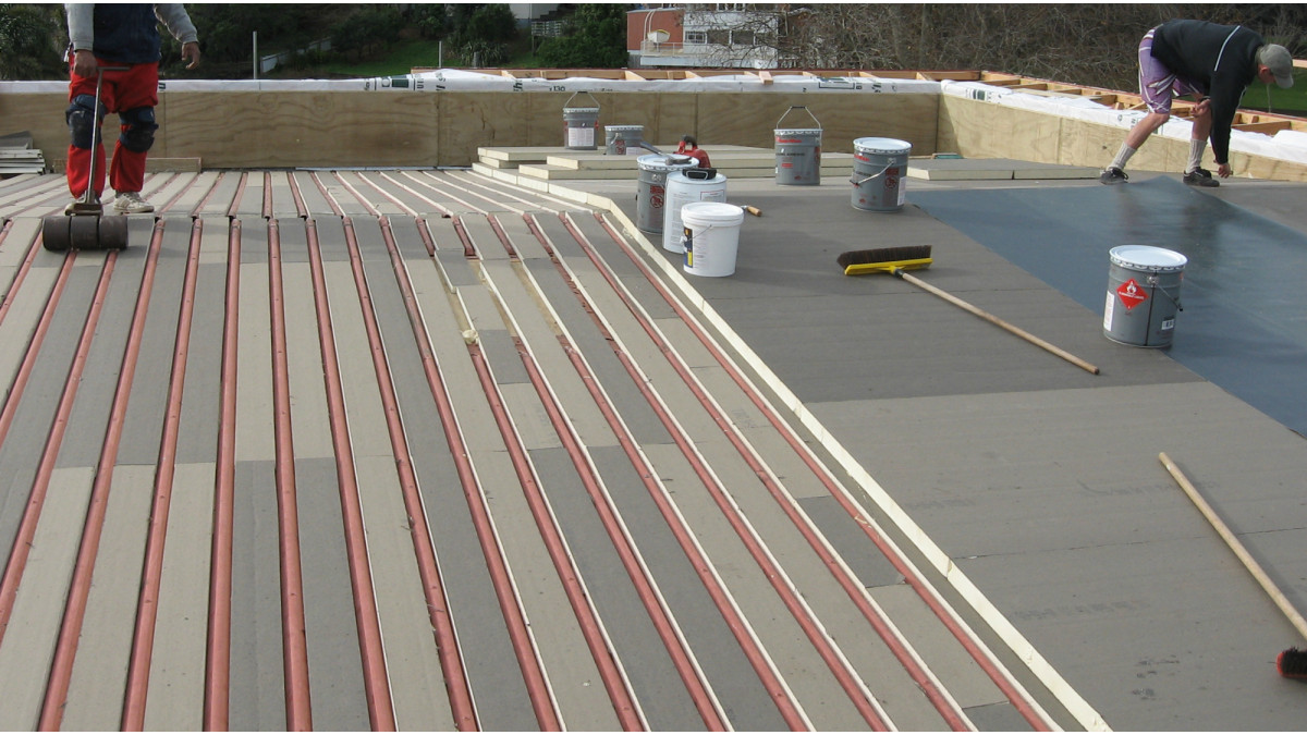 Re-roofing over steel roof with insulation panels.