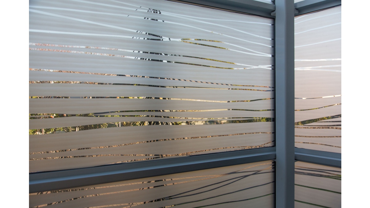 The layering of the frosted film balances transparency and privacy.