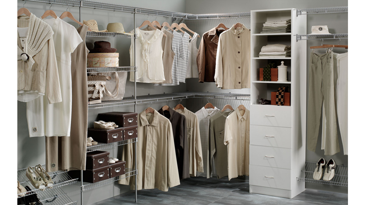 A walk in wardrobe fitted with a wire wardrobe organiser system.