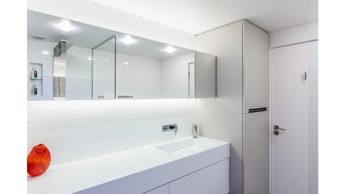 Vanity top, integrated sink and cabinet doors in Corian Architects White (now superseded by Corian Designer White). Design by Celia Visser. National Kitchen and Bathroom Association award-winning bathroom (2014).