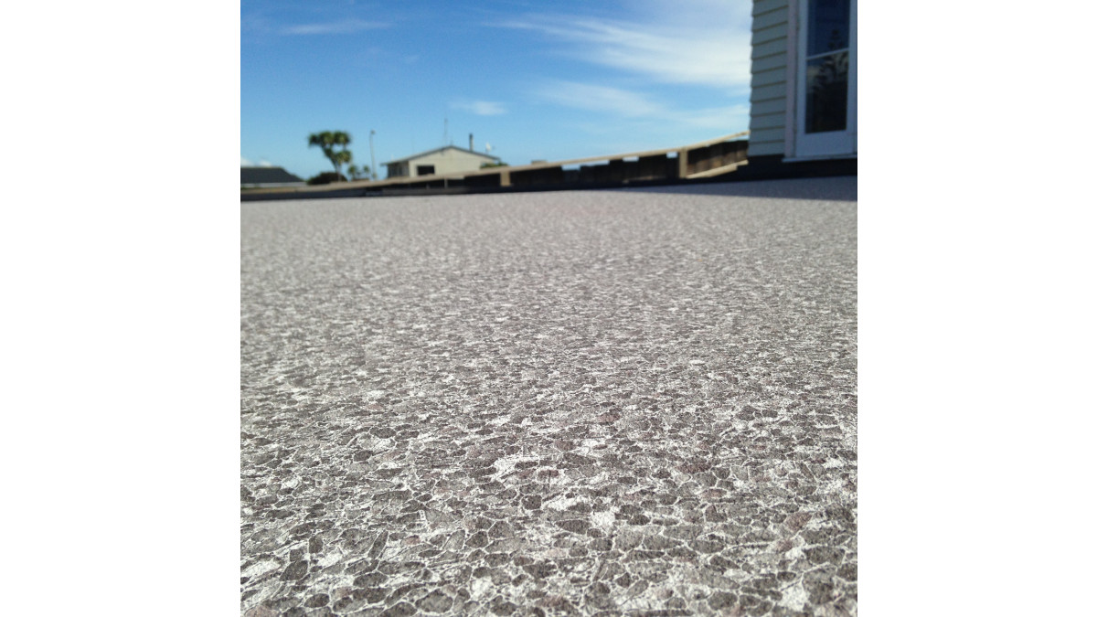 Sand Pebble emulates an aggregate concrete look.