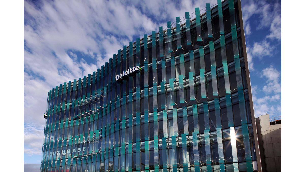 Four-metre high coloured glass fins form a veil.