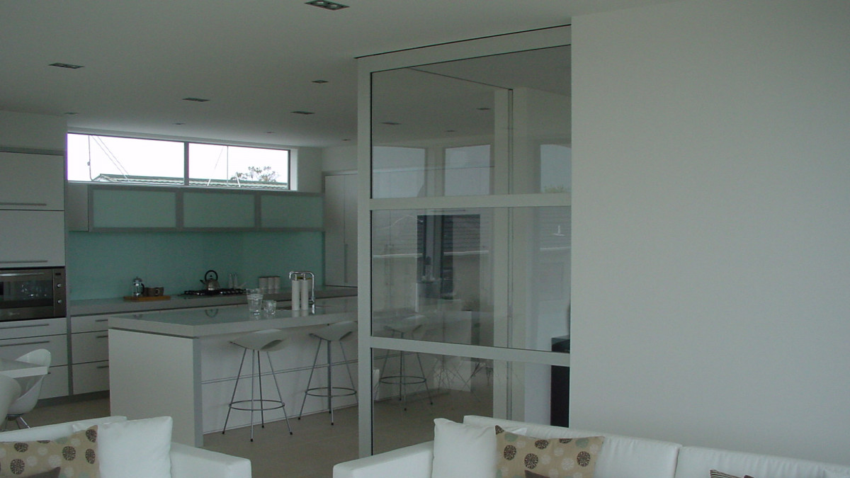 Corner meeting cavity sliders with New Yorker doors.