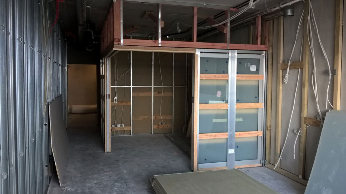 Corner meeting cavity sliders apartment under construction.