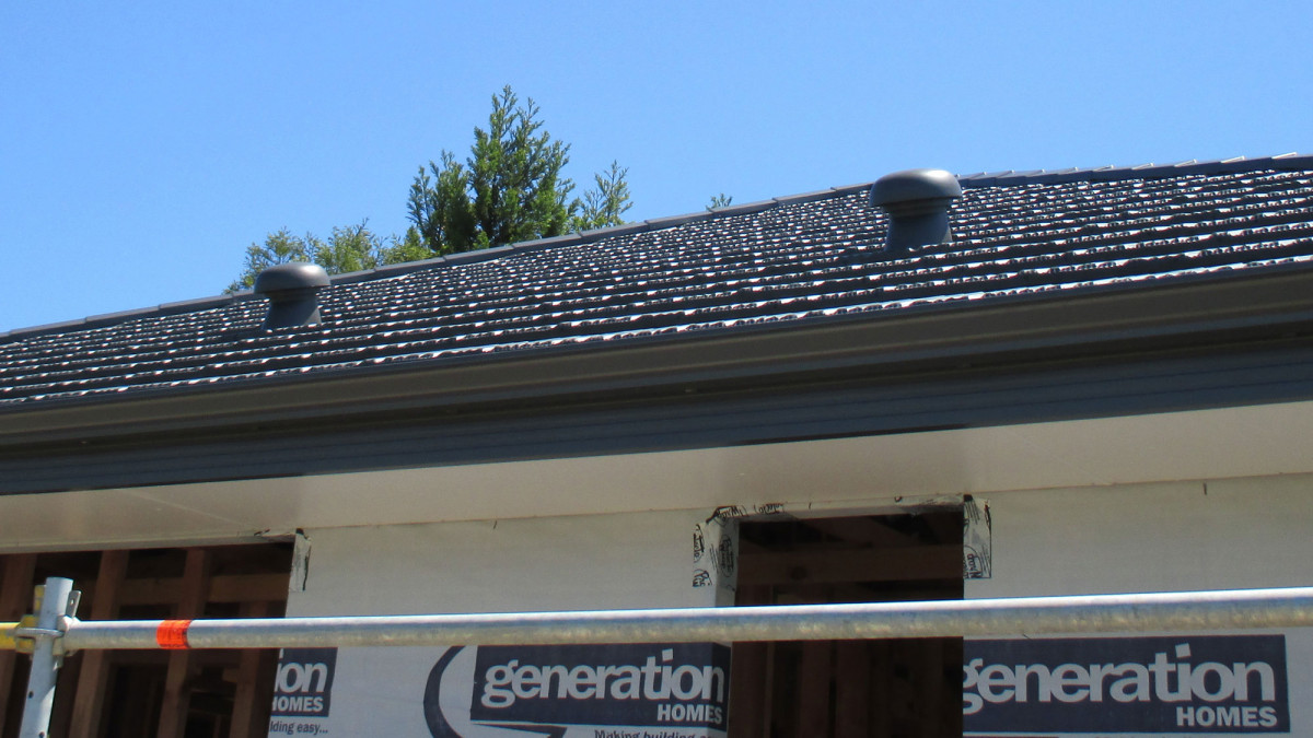 Metrotile HV160 Extraction Vents installed over the bathrooms of this new home. 