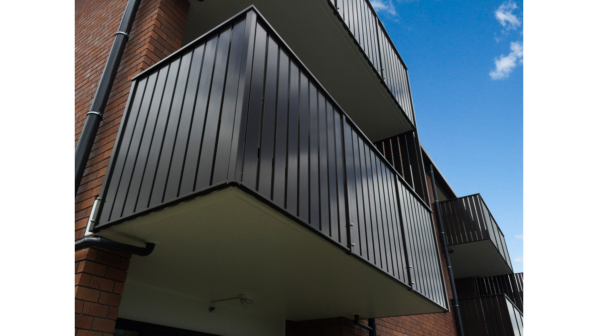 Clean lines of the slats conceal the concrete balcony floor.