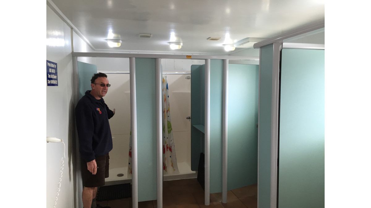 Max Sullivan, owner of the Golden Grove Kiwi Holiday Park shows the Resco partitions which are still in great shape 18 years after being installed.