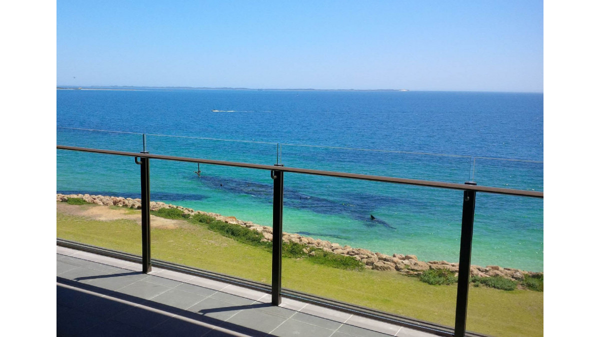 Unex Semi-Framed Balustrade featured in foreground looking out to a view of the Indian Ocean.