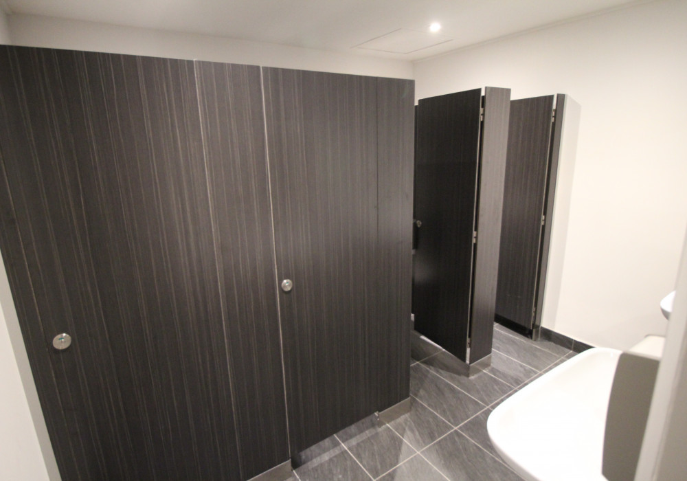 KerMac Industries Deliver Upscale Toilet Cubicle System for 99 Queen Street