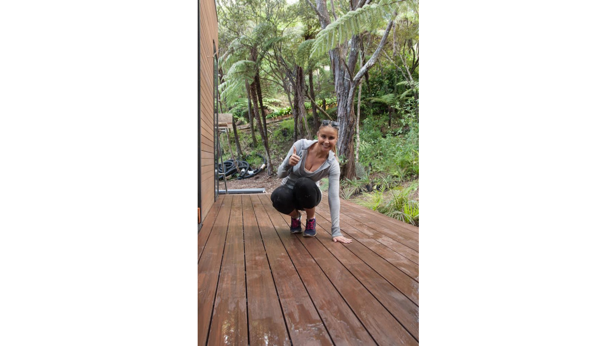 Kylie’s pretty happy with the finished deck, especially how well it ties in with the cedar cladding and blends in with the bush.