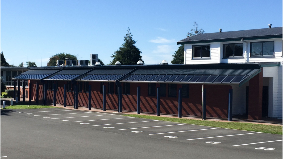 Renovated school building looks smart with glazed canopy.