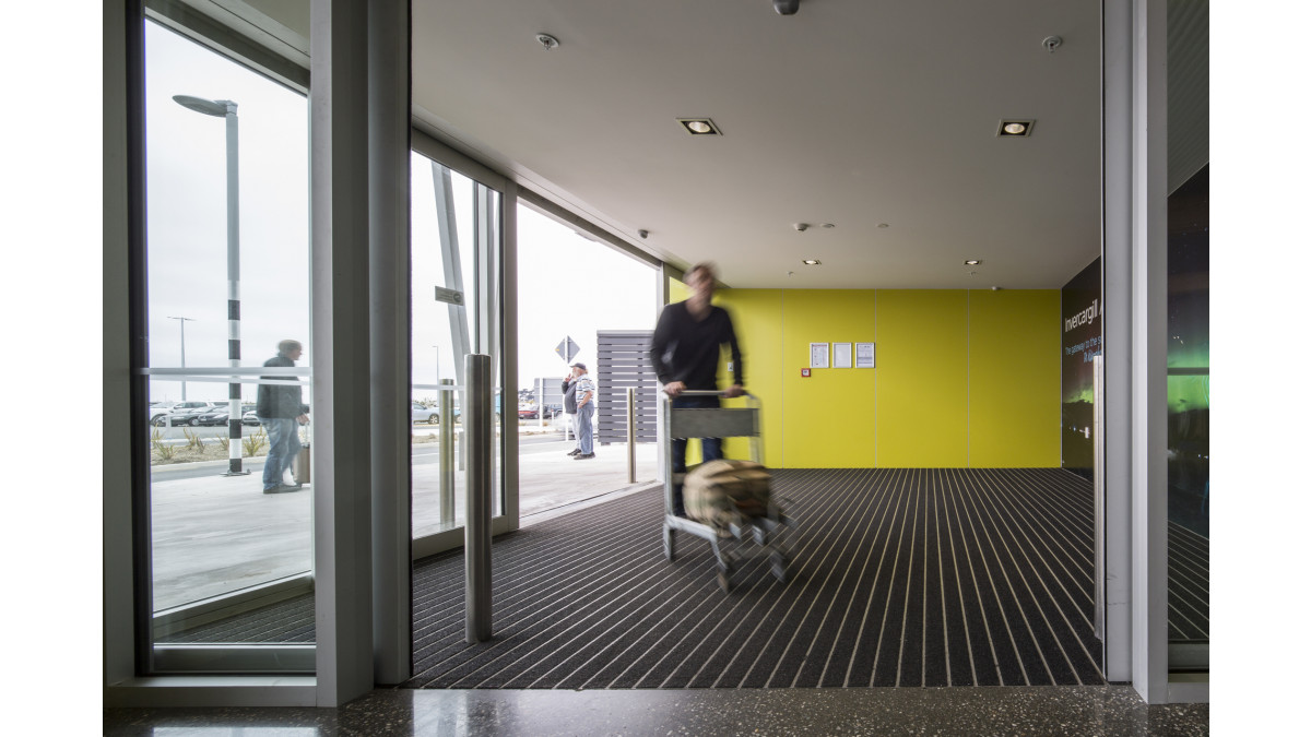 Wind lobbies ensure visitors take several steps on the entrance matting before entering the atrium.