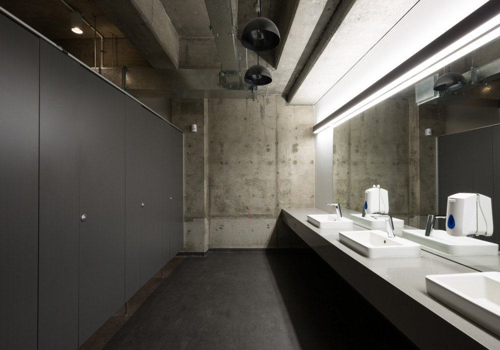 Durable Resco Toilet Cubicles Fit Aesthetic in Mediaworks' Floor Refurbish