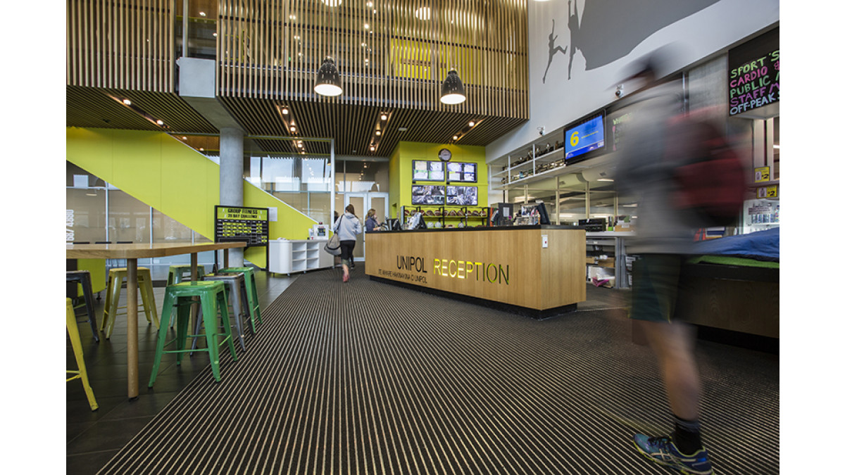 The pinstripe design effect of the CoralTread is reflected in the wooden slats adorning the mezzanine and feature walls downstairs.