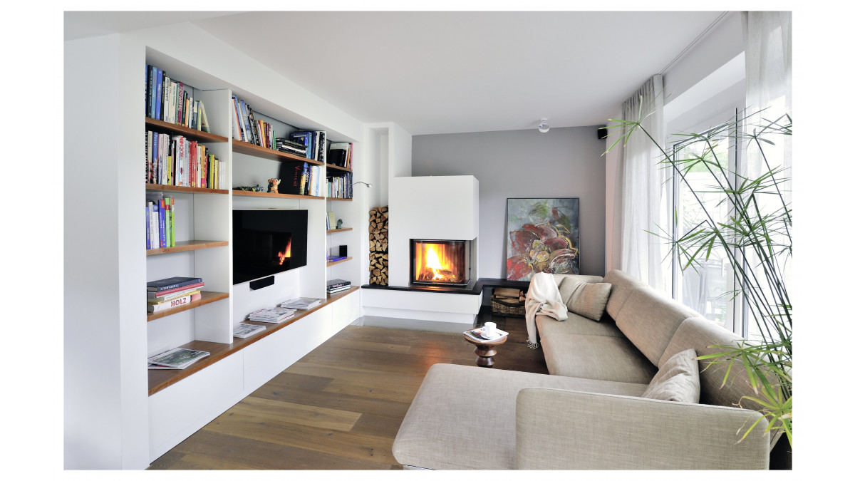 A Spartherm corner wood fire. Interior design by Jeanette Heerwagen, Germany.