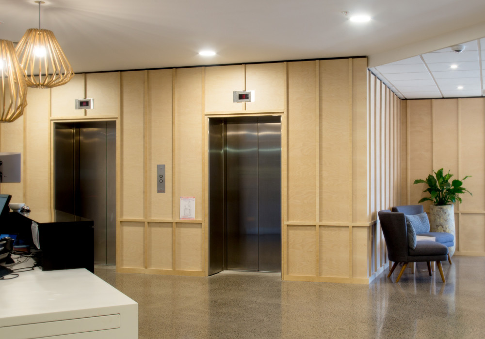 Pre-finished Ply Adds Warmth in Reception Upgrade