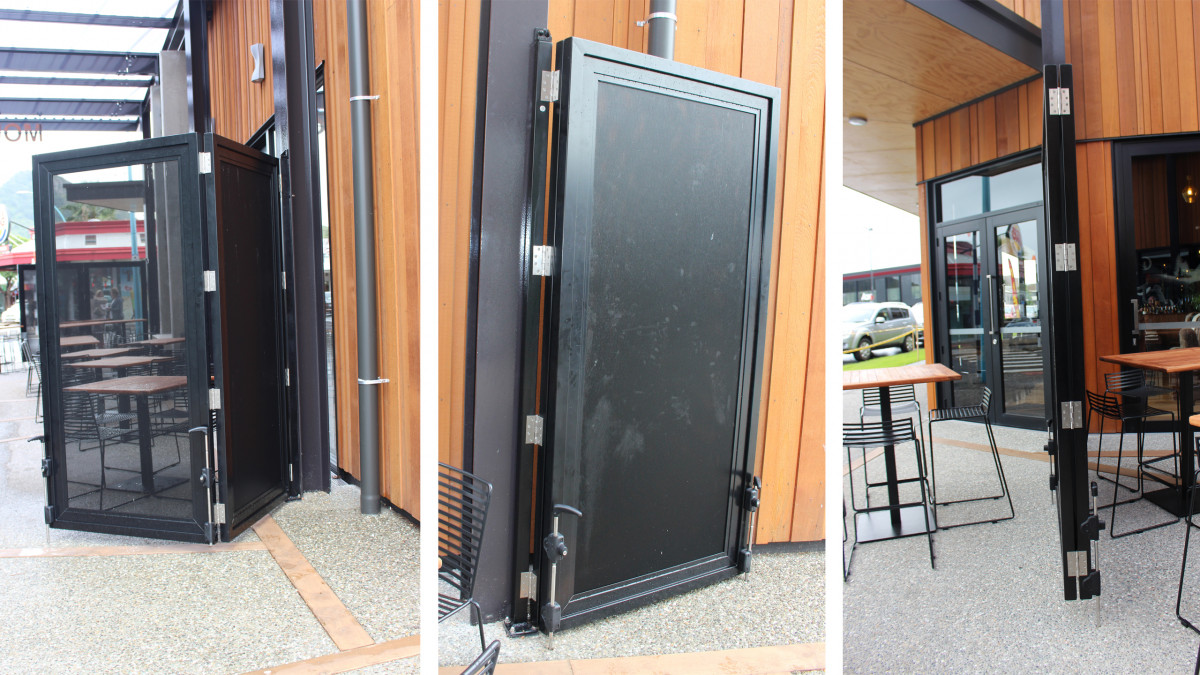 Clearguard screens and windbreak for outdoor cafe area solid and hinged.