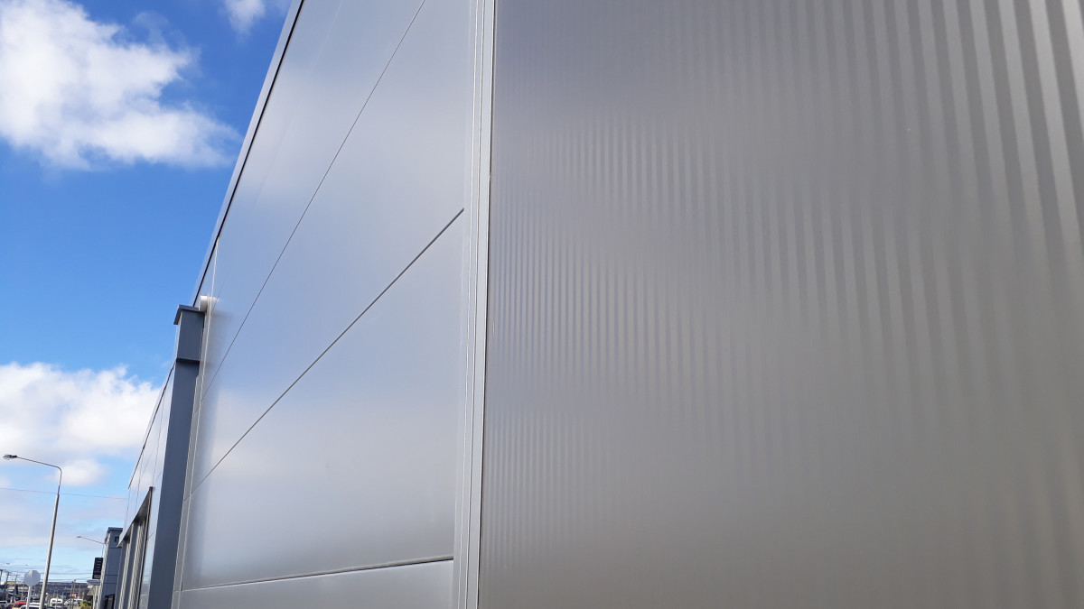 Exterior: Side wall showing Architectural Wall Panels.