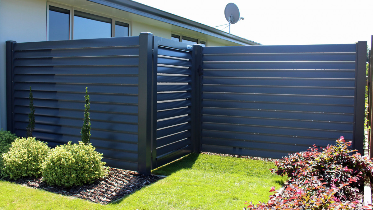 Louvre fence and matching gate and feature panels on large entranceway.