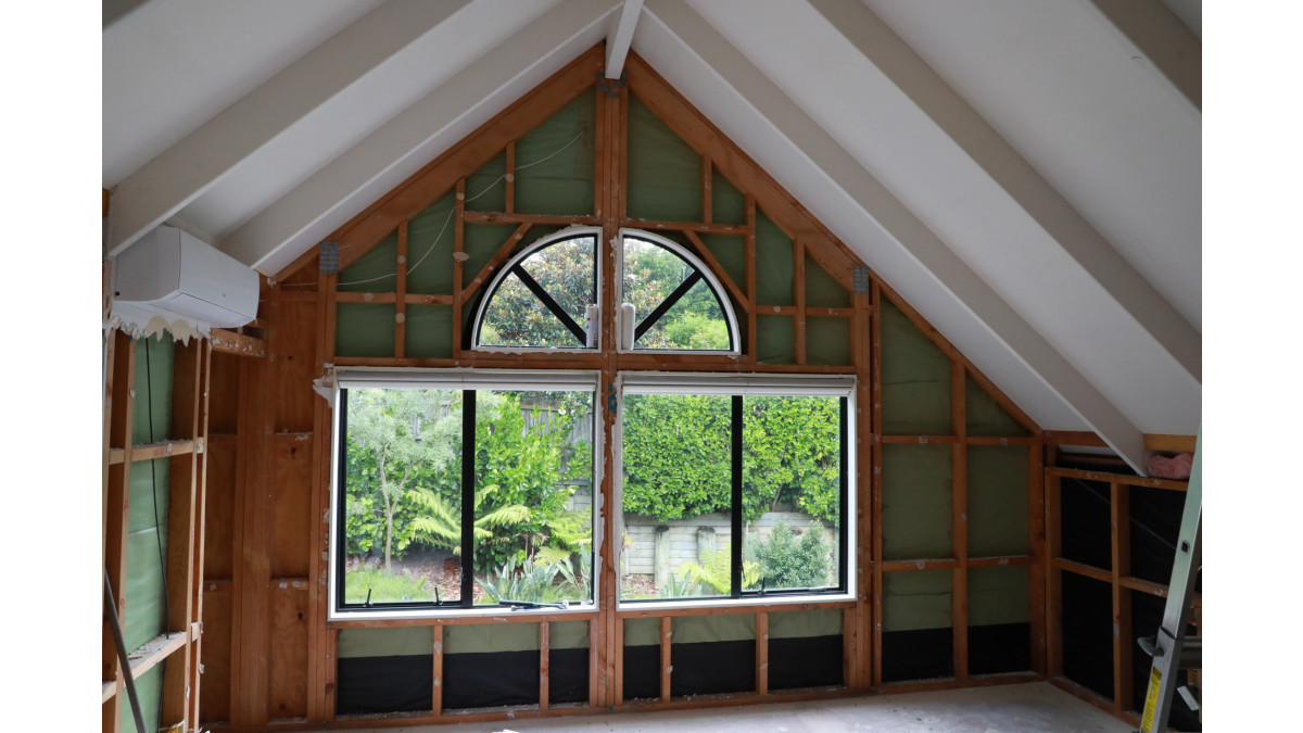 Skillion roof with exposed rafters.