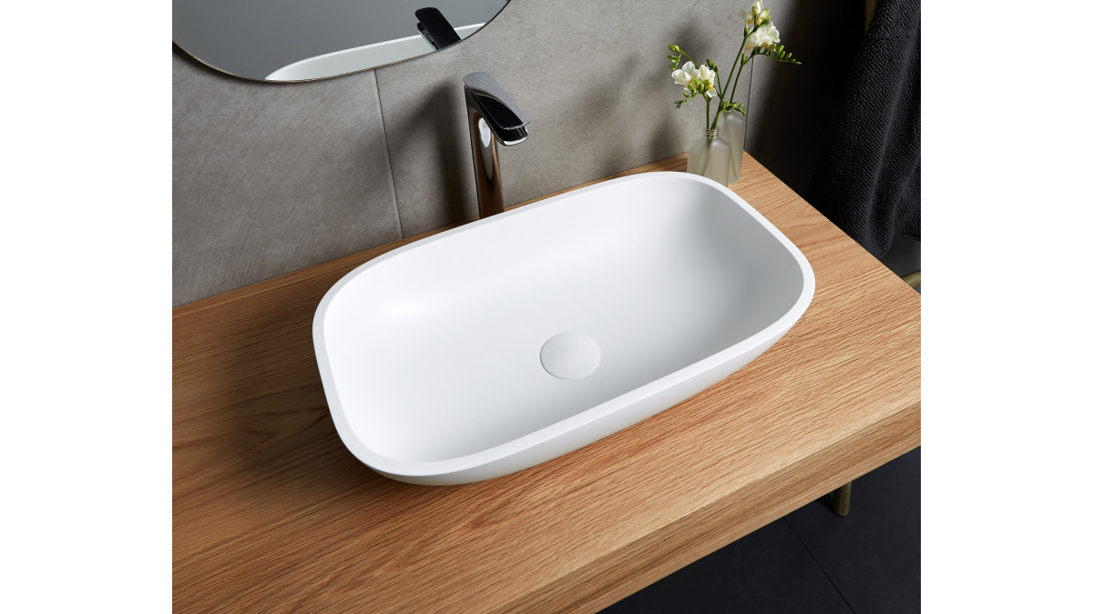 On bench Corian EOS PWB 304 basin in Glacier White.