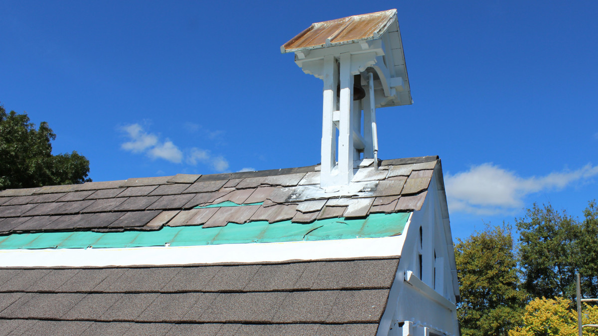 Damaged tiles on the belltower. 