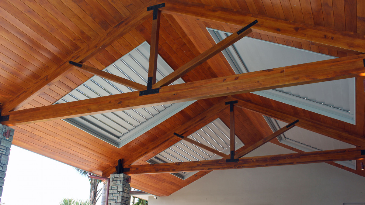 Four Bask Louvre Roofs integrated into stunning outdoor roof over pool.