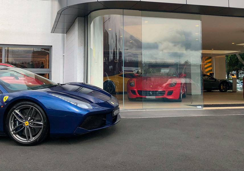 Curved Glass Ensures Premium Views of Ferraris on Display