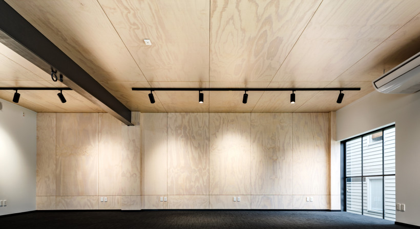 From Concrete Workshop to Plywood-Lined Office