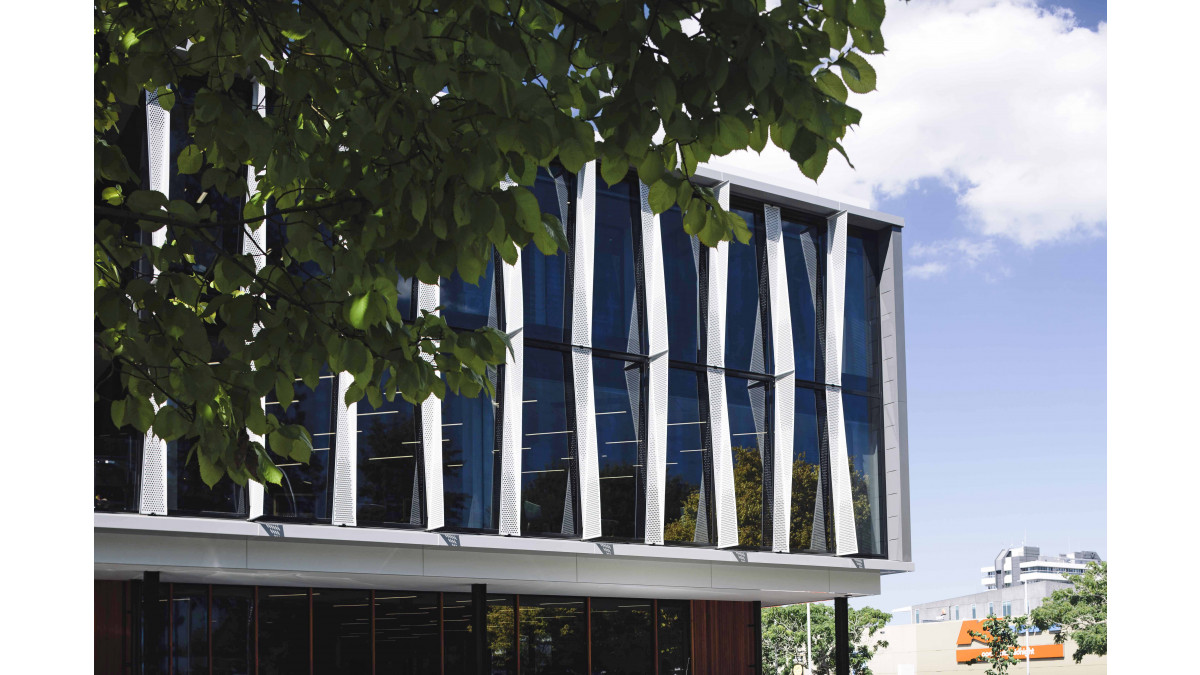 White perforated sun louvres were used on the outside of the APL Structural Glazed curtainwall.