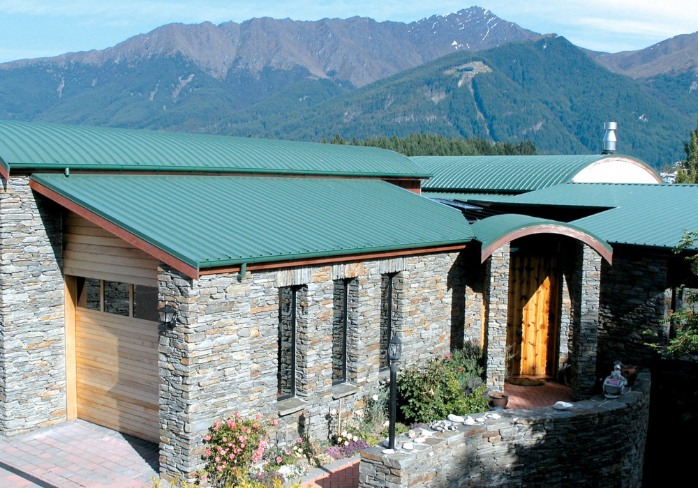 Crimp Curved Roof Adds Detail to Family Home