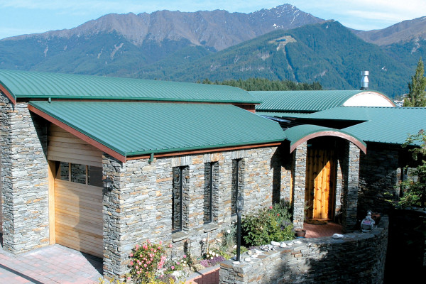 Crimp Curved Roof Adds Detail to Family Home