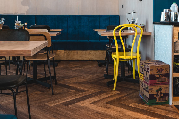 How Multilayer Herringbone Flooring Fit the Criteria for Millies Café 